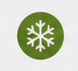 Grüne kreisförmige Fläche mit einer weißen Schneeflocke in der Mitte.