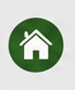 Symbol eines Hauses in grünem Kreis.